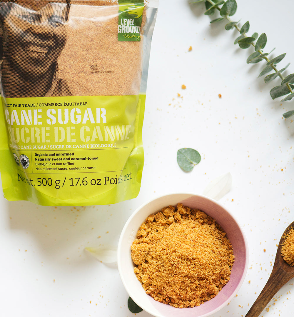 Organic cane sugar, 500 gram package, dish of cane sugar, eucalyptus branch , on white table