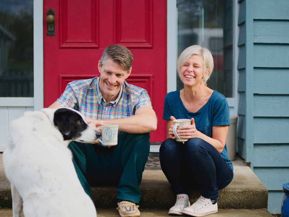 Photo of our co-founders and their dog. 